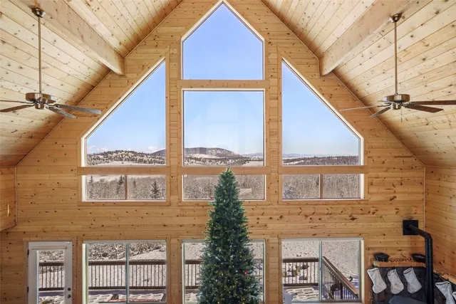 a front view of a house with large windows