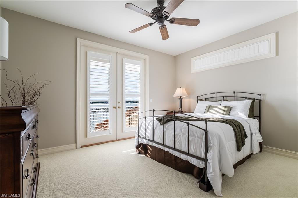 1942 Kingfish Road Naples, FL 34102 - Photo 31 of 43 a bed sitting in a spacious bedroom next to a window