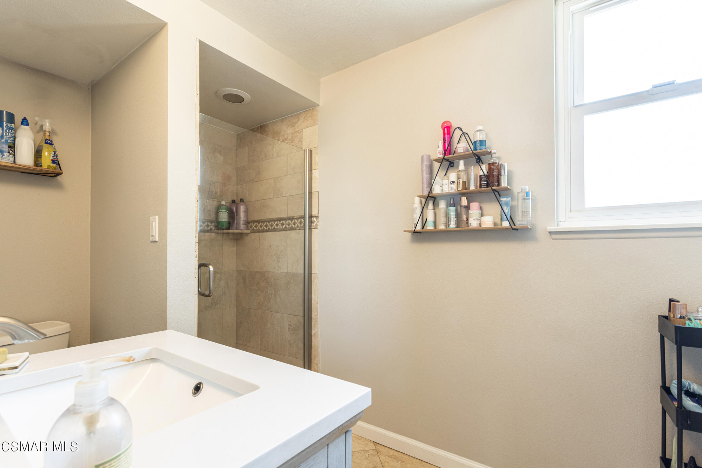 2737 Harrington Road Simi Valley, CA 93065 - Photo 21 of 32 a bathroom with a sink and a mirror