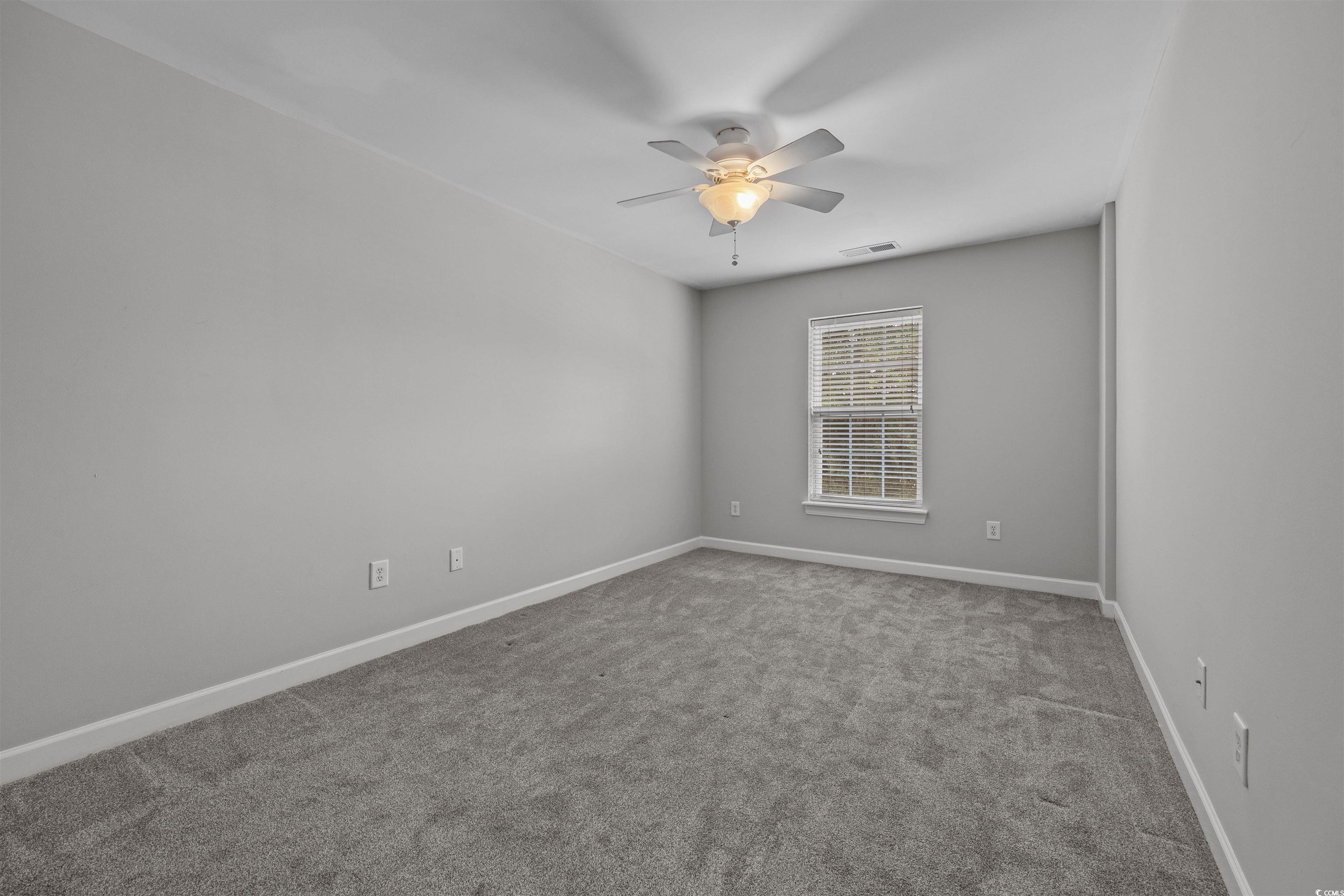 1060 Fairway Lane Conway, SC 29526 - Photo 14 of 32 Carpeted spare room with baseboards and ceiling fan