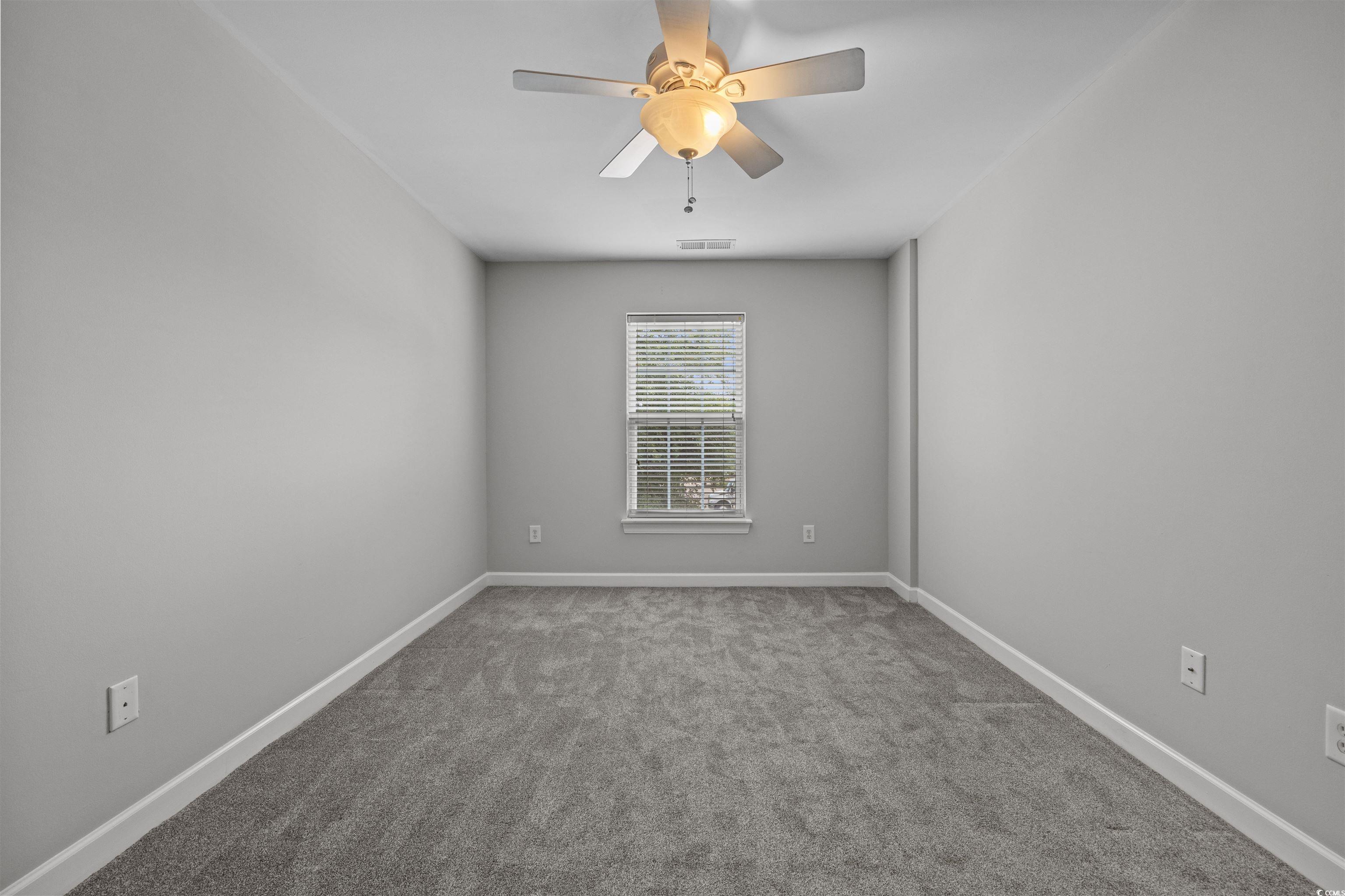 1060 Fairway Lane Conway, SC 29526 - Photo 17 of 32 Spare room featuring light colored carpet and a ceiling fan