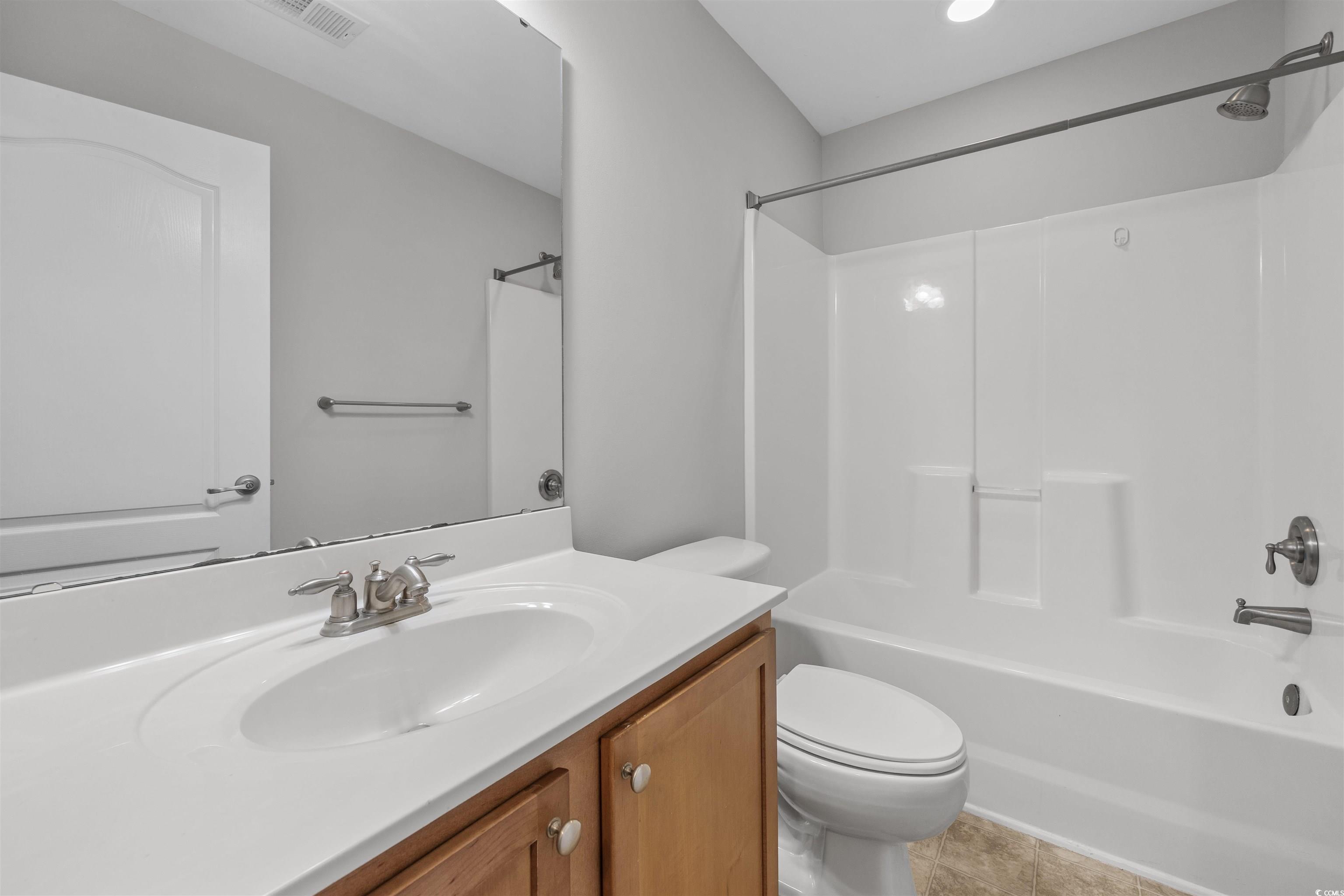 1060 Fairway Lane Conway, SC 29526 - Photo 20 of 32 Bathroom featuring shower / bathtub combination, vanity, and light tile patterned flooring