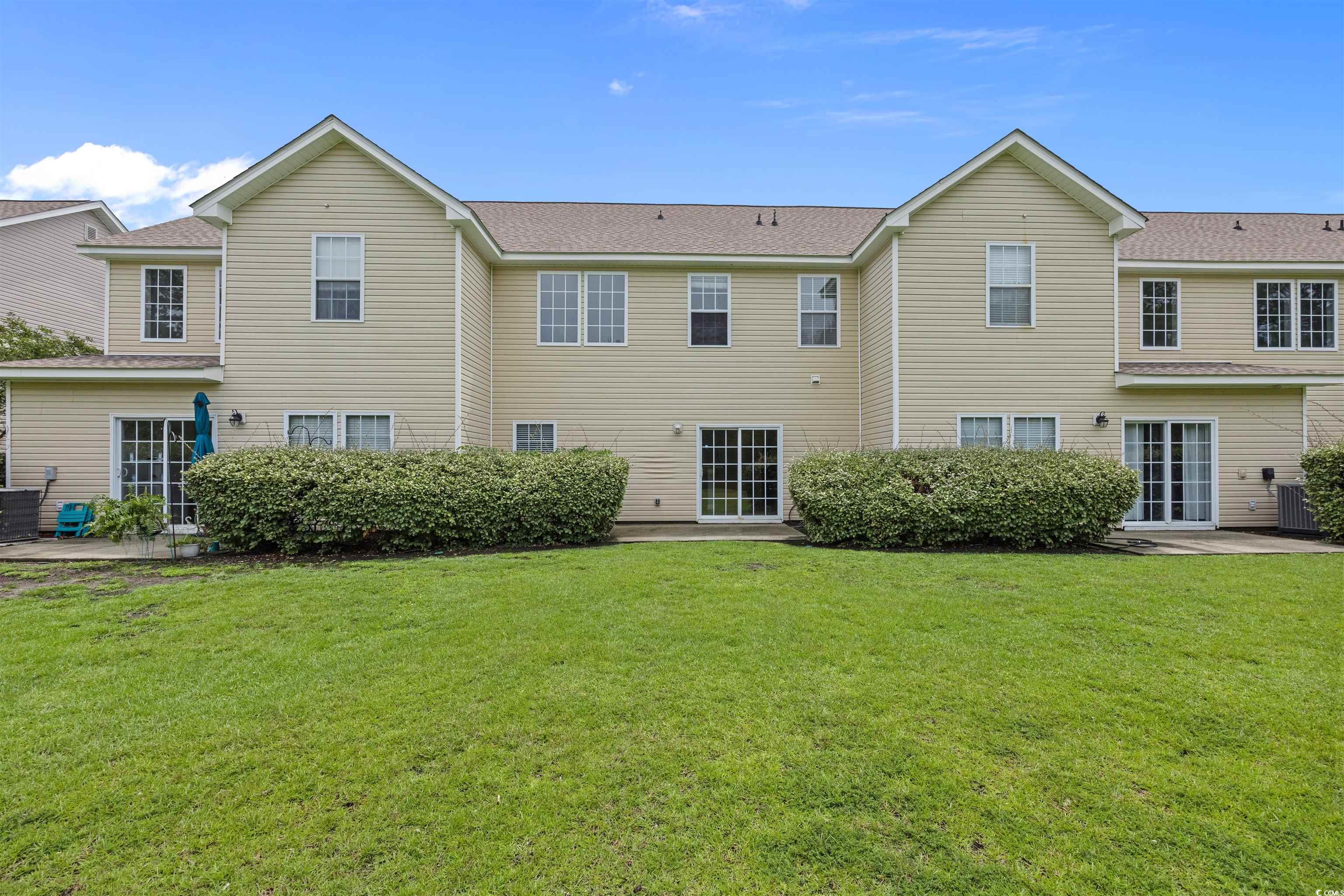 1060 Fairway Lane Conway, SC 29526 - Photo 27 of 32 Back of property featuring a patio area, a yard, and a shingled roof