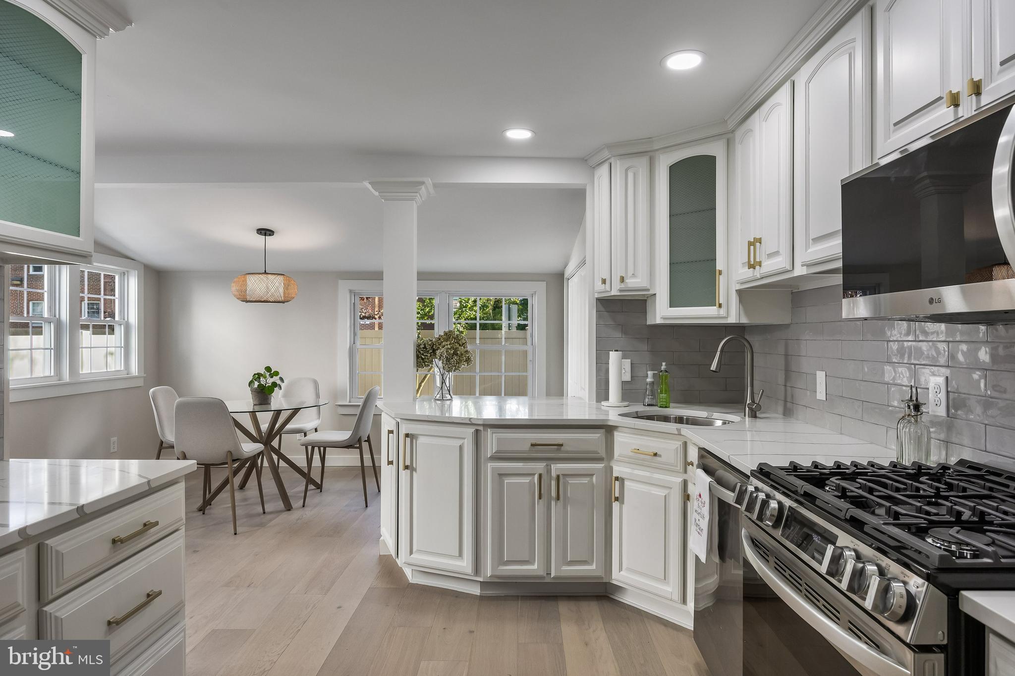 82 East 3rd Street Moorestown, NJ 08057 - Photo 14 of 33 a kitchen with granite countertop a sink stove and cabinets