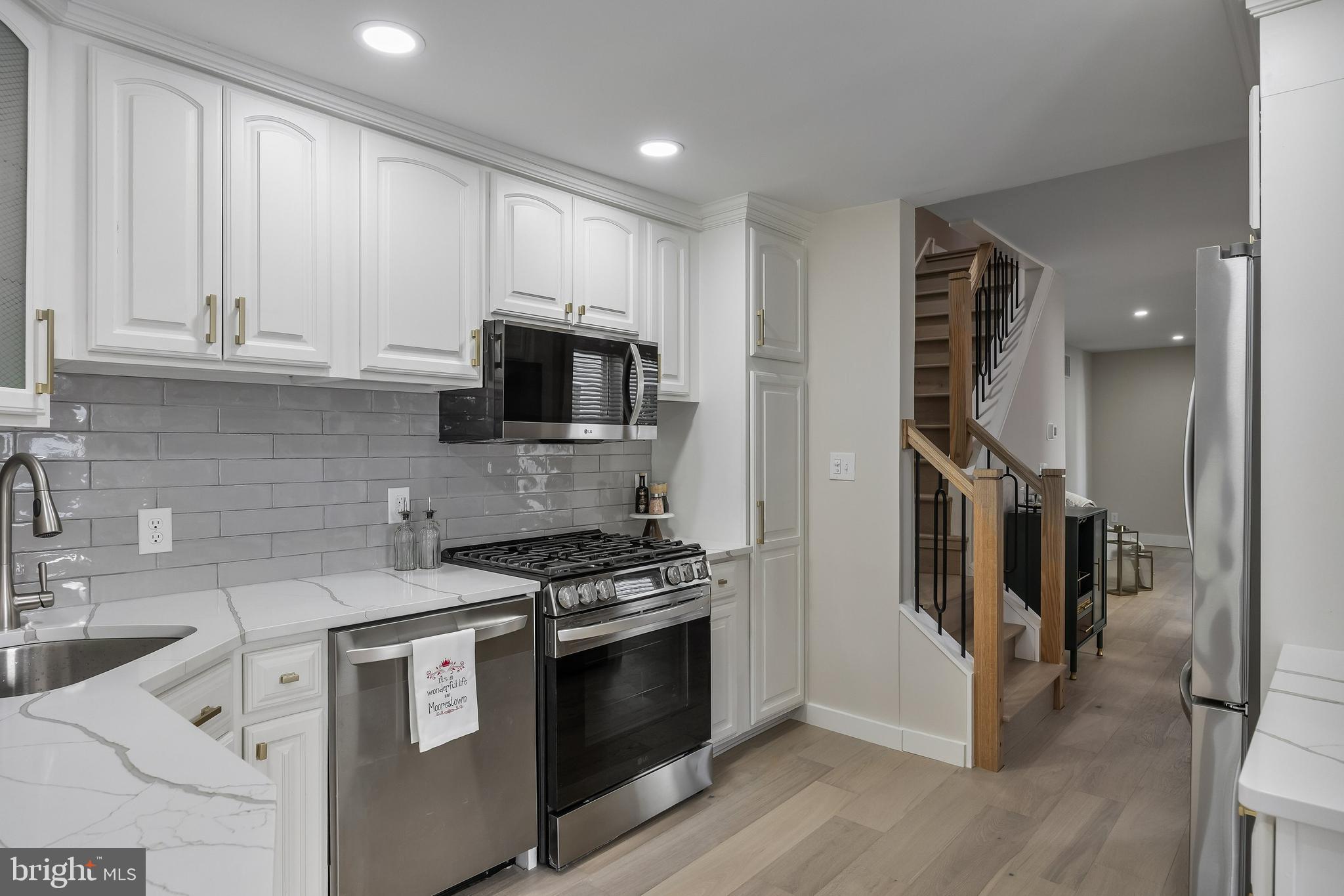 82 East 3rd Street Moorestown, NJ 08057 - Photo 17 of 33 a kitchen with stainless steel appliances granite countertop a stove a sink and a refrigerator