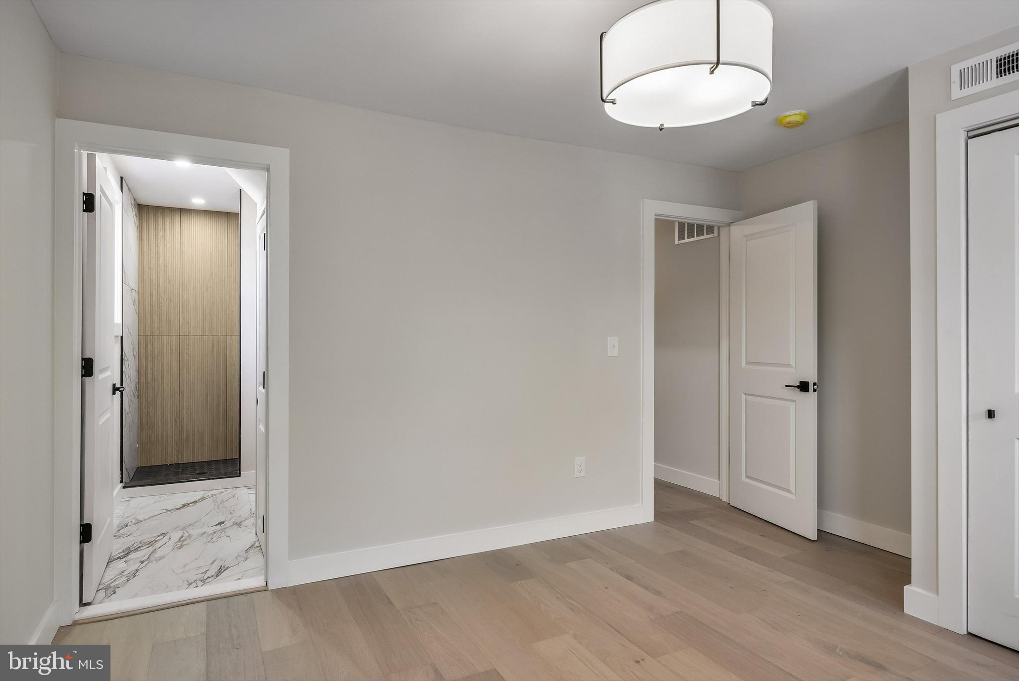 82 East 3rd Street Moorestown, NJ 08057 - Photo 22 of 33 a view of an empty room and wooden floor