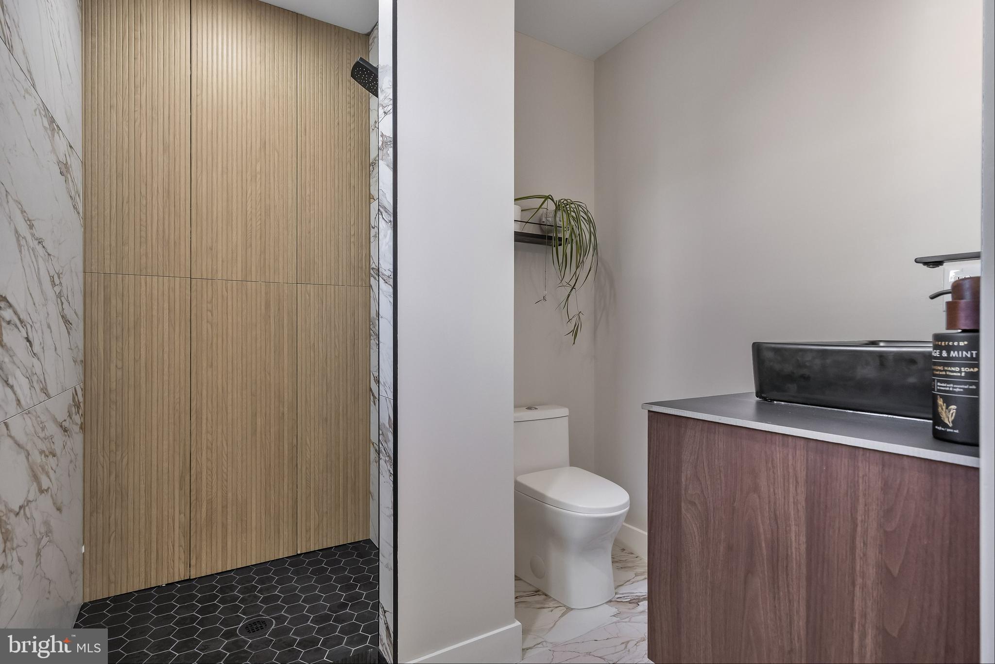 82 East 3rd Street Moorestown, NJ 08057 - Photo 23 of 33 a bathroom with a toilet a sink and a shower