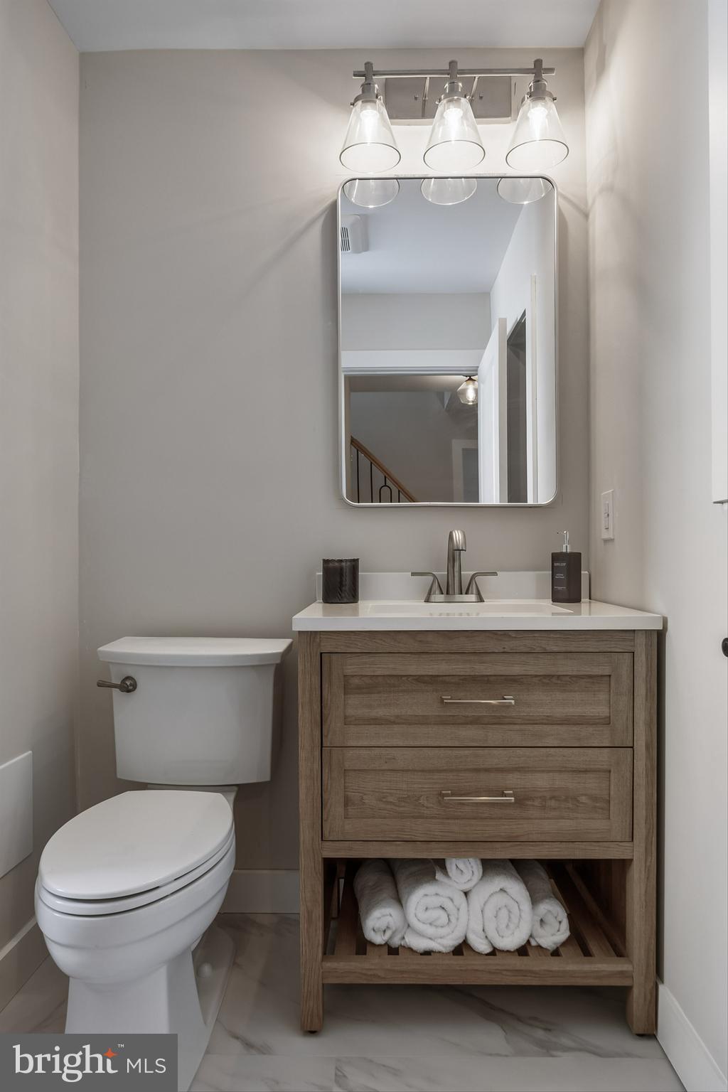 82 East 3rd Street Moorestown, NJ 08057 - Photo 27 of 33 a bathroom with a sink vanity mirror and toilet