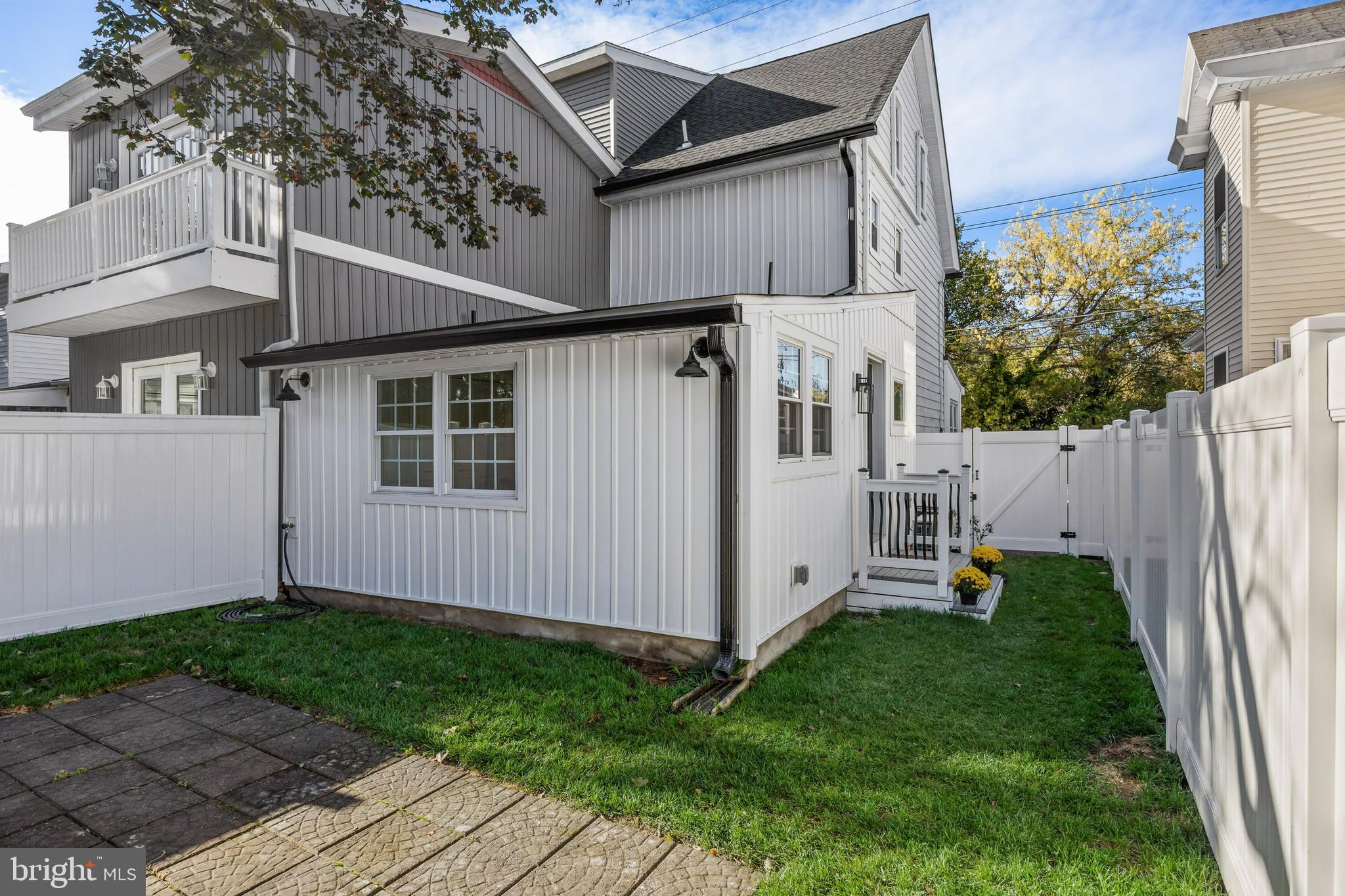 82 East 3rd Street Moorestown, NJ 08057 - Photo 32 of 33 a view of a house with a yard and wooden fence
