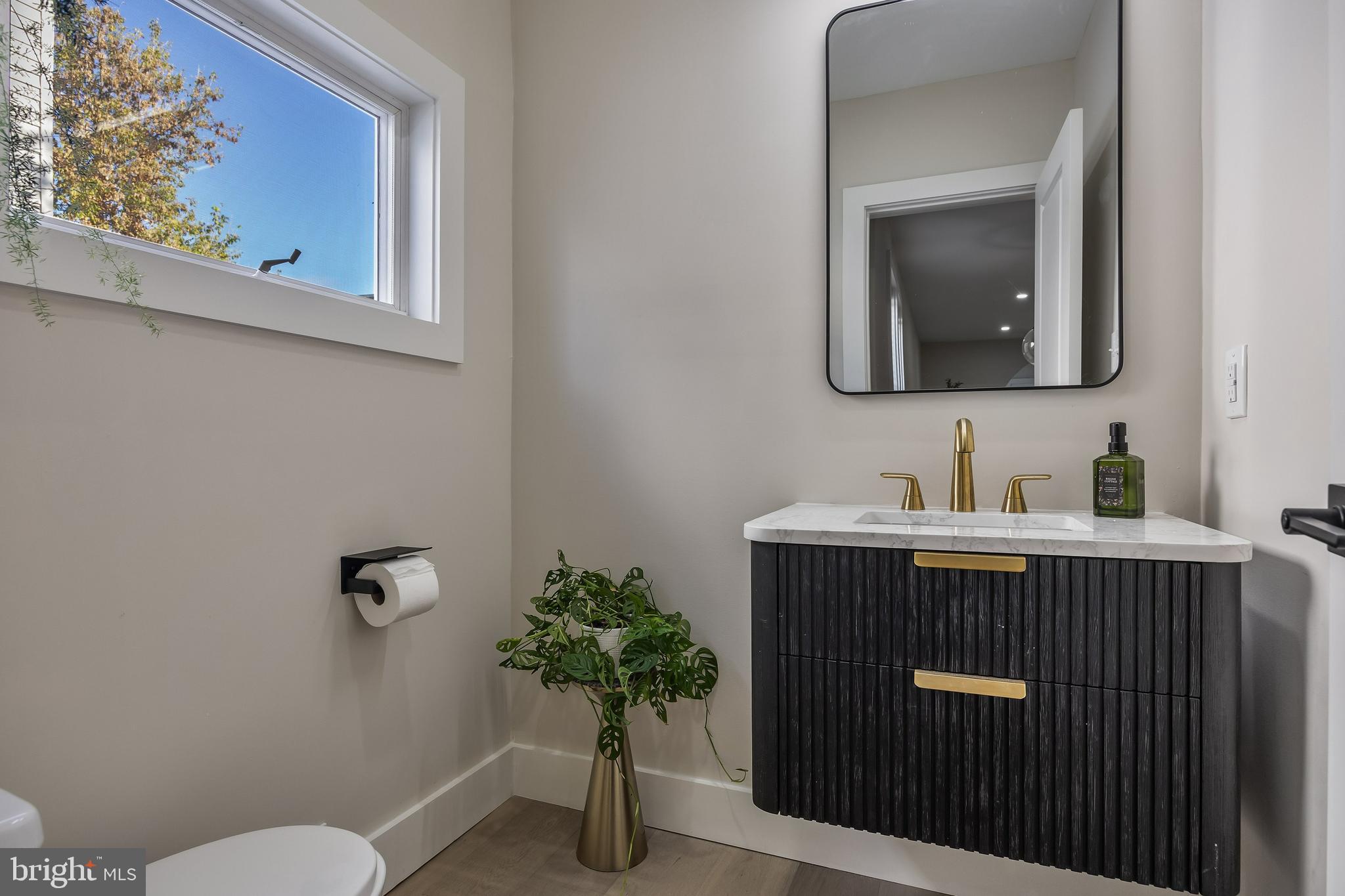 82 East 3rd Street Moorestown, NJ 08057 - Photo 10 of 33 a bathroom with a sink a mirror and a toilet