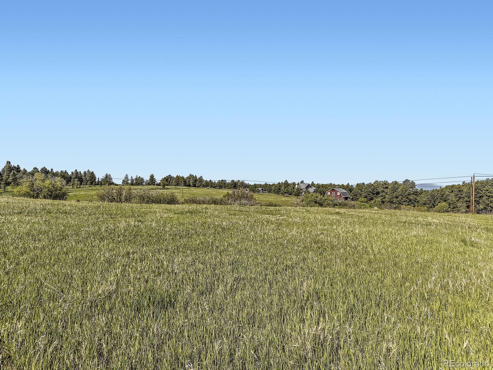 104 Bill Davis Road Franktown, CO 80116 - Photo 13 of 14 a view of a lake and mountain