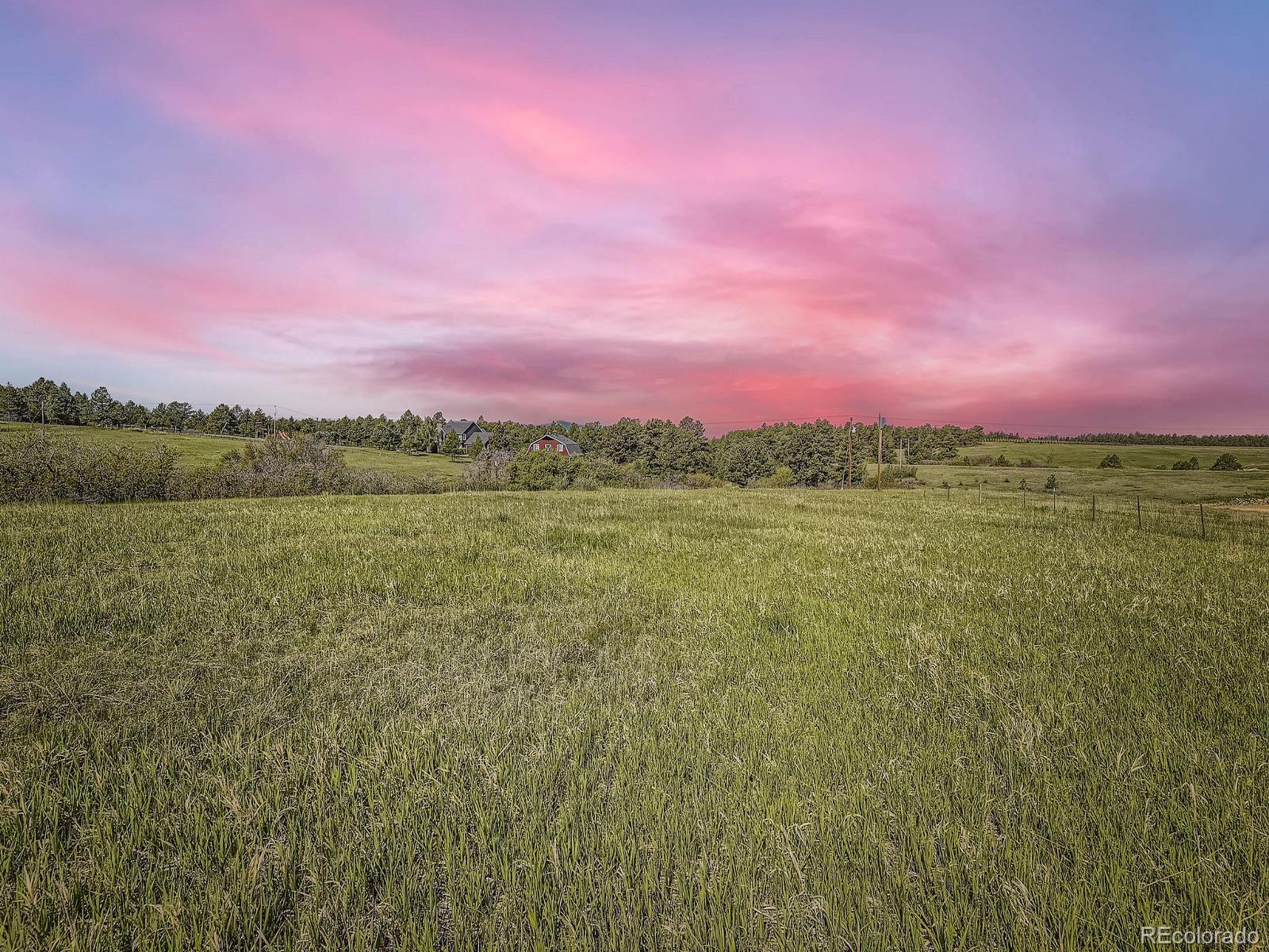 104 Bill Davis Road Franktown, CO 80116 - Photo 14 of 14 a view of a lake with a yard