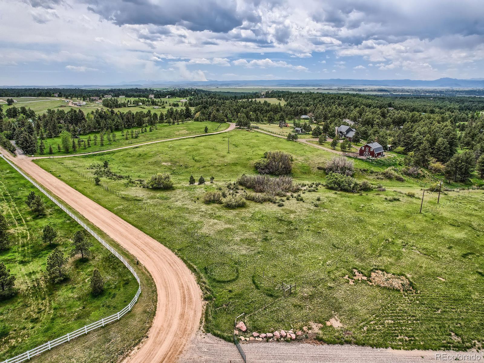 104 Bill Davis Road Franktown, CO 80116 - Photo 6 of 14 a view of a lush green field