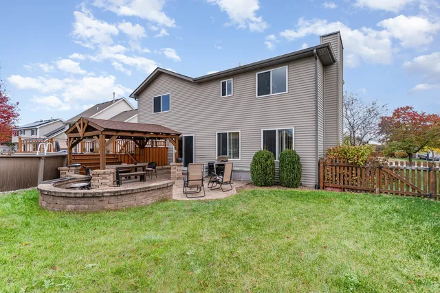a view of a house with sitting area and swimming pool