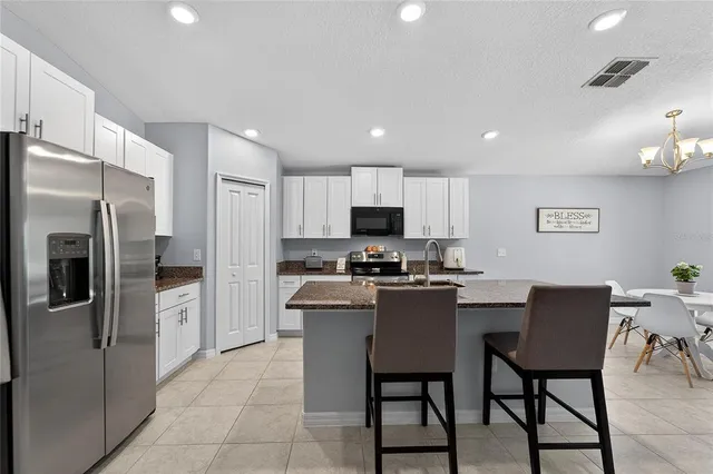 a bathroom with double sink and a mirror