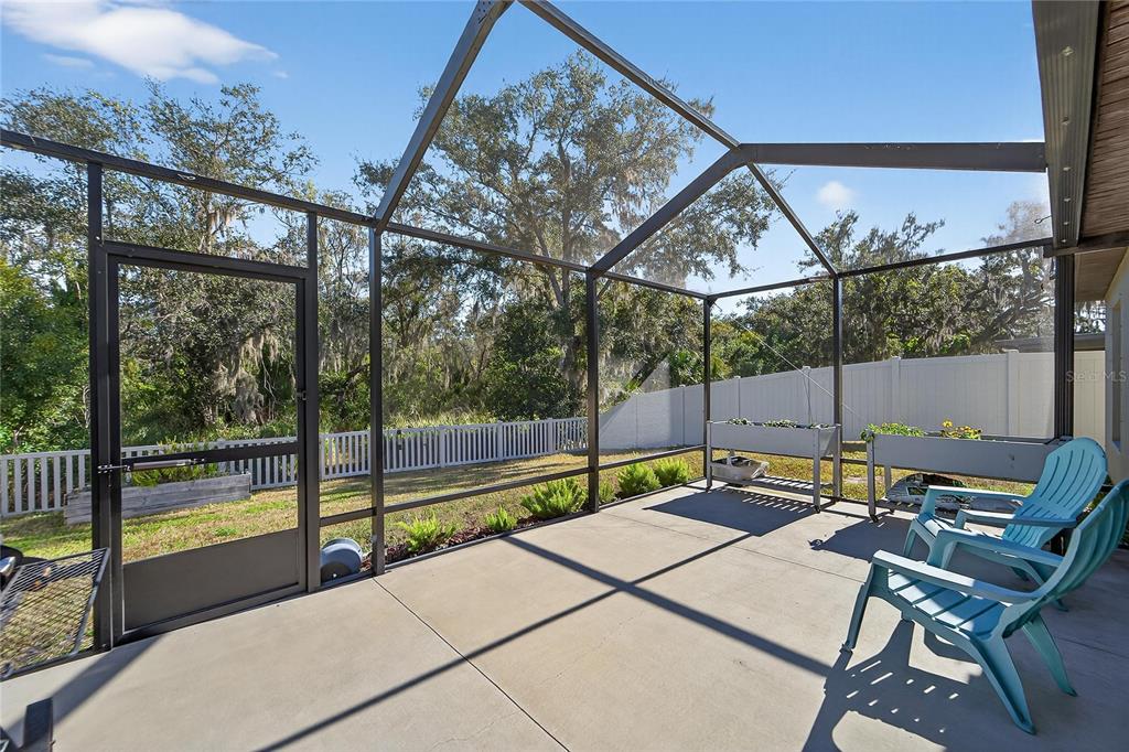 1728 Fred Ives Street Ruskin, FL 33570 - Photo 3 of 78 a view of a chairs and table in the patio