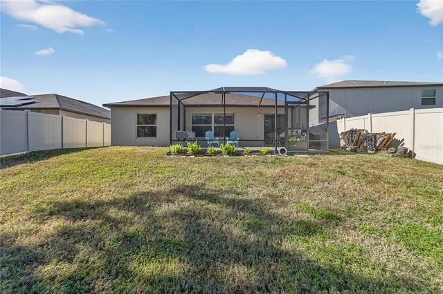 a view of a park with iron fence