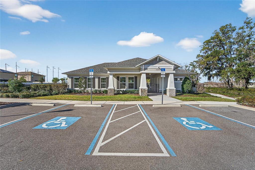 1728 Fred Ives Street Ruskin, FL 33570 - Photo 67 of 78 a view of a house with a swimming pool and a yard
