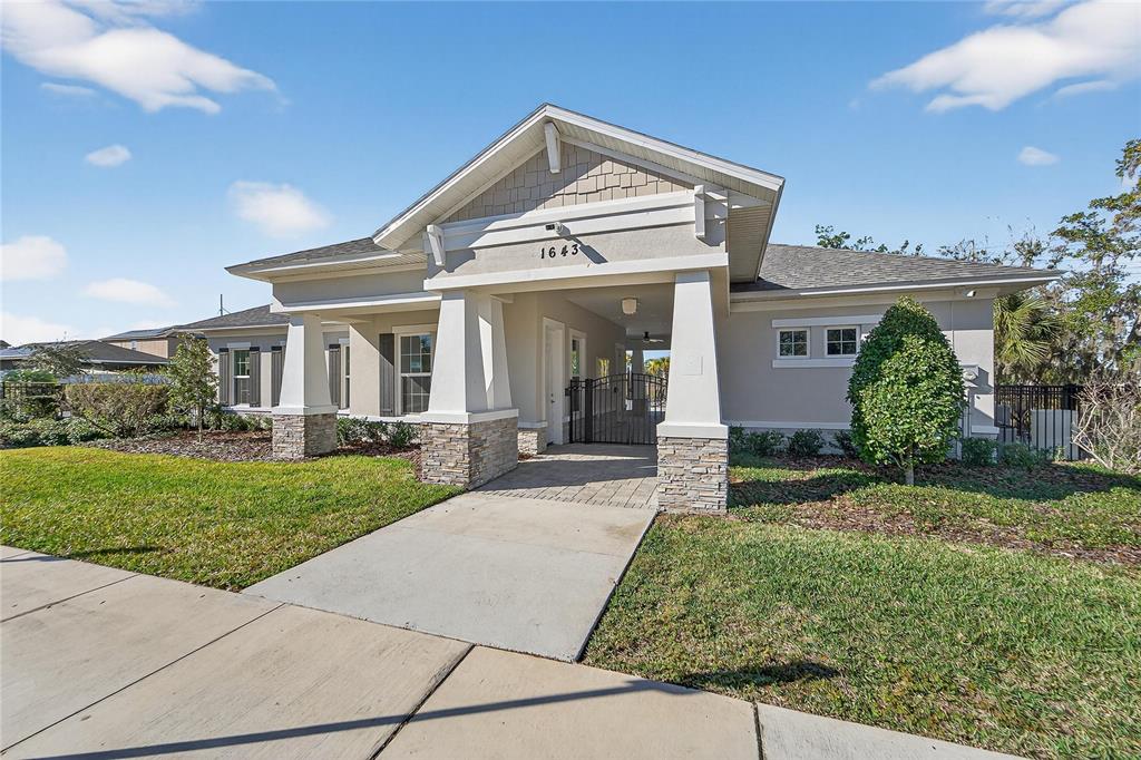 1728 Fred Ives Street Ruskin, FL 33570 - Photo 68 of 78 a front view of a house with a yard
