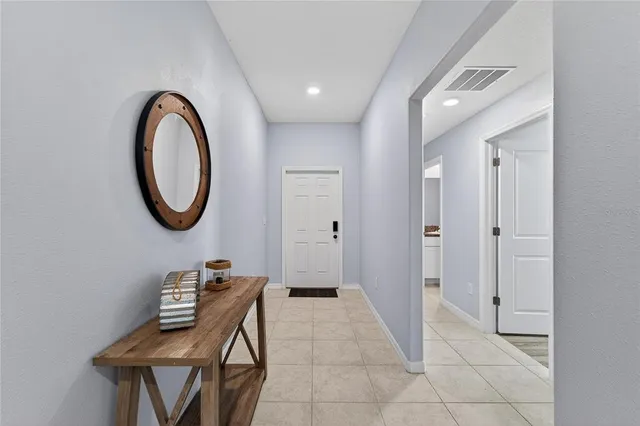 a view of a workspace with furniture and gym equipment