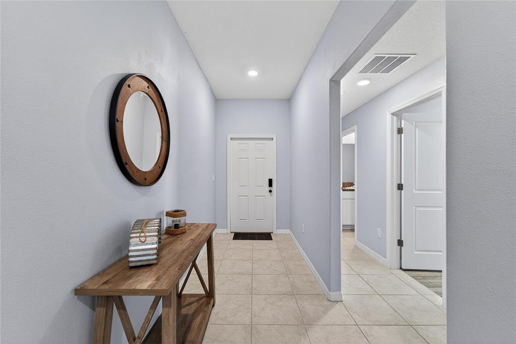 1728 Fred Ives Street Ruskin, FL 33570 - Photo 9 of 78 a view of a hallway with seating area