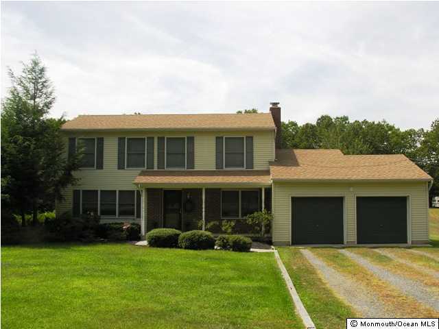 164 South New Prospect Road Jackson, NJ 08527 - Photo 1 of 3 a front view of a house with a yard