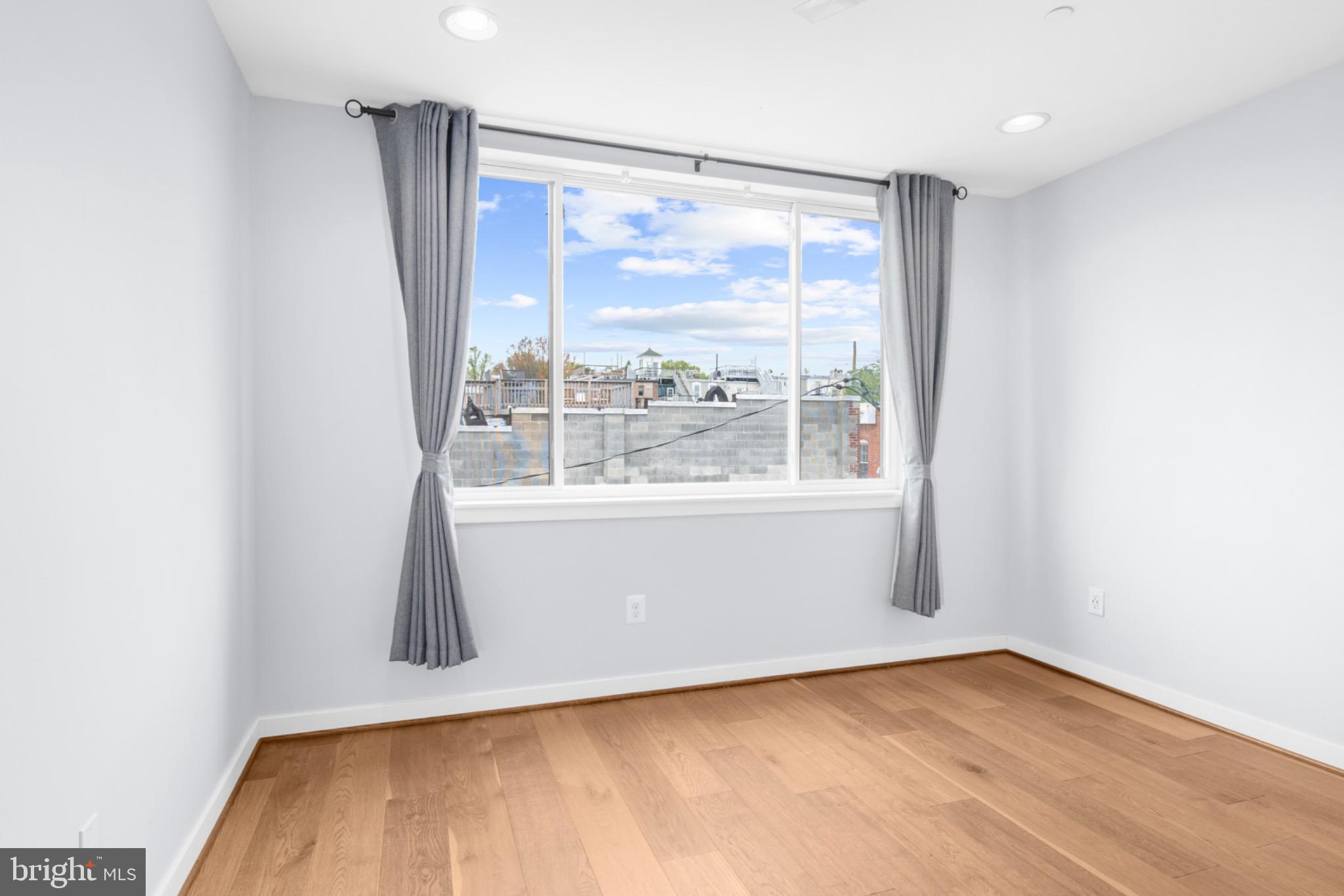 2317 East Fairmount Avenue Baltimore, MD 21224 - Photo 19 of 30 Bright and airy room with scenic views.