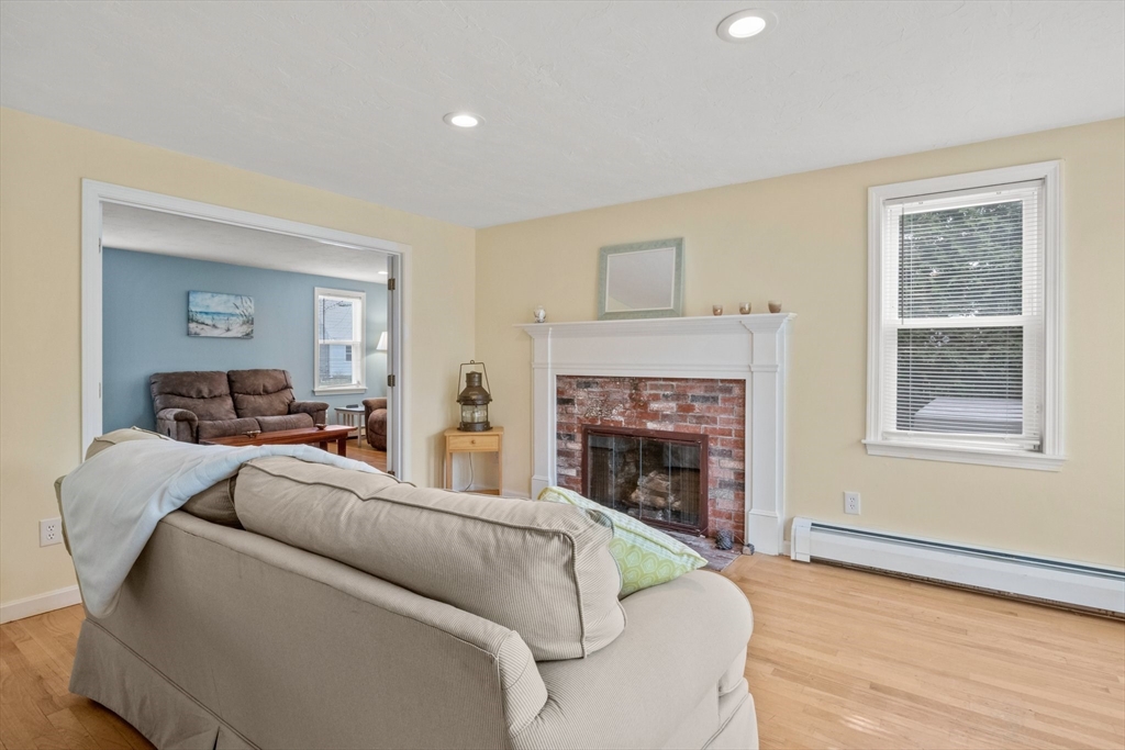 60 Tupper Avenue Sandwich, MA 02563 - Photo 12 of 35 a living room with furniture and a fireplace