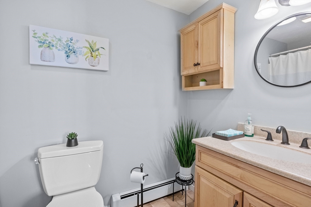 60 Tupper Avenue Sandwich, MA 02563 - Photo 15 of 35 a bathroom with a toilet a sink and mirror