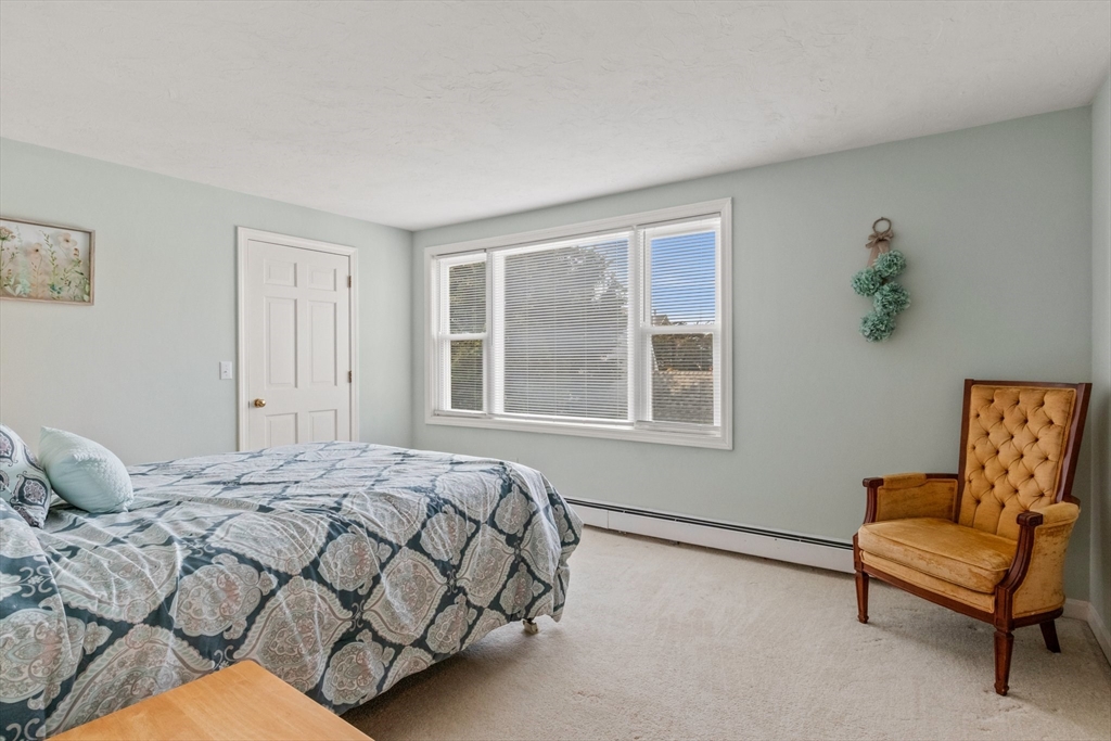 60 Tupper Avenue Sandwich, MA 02563 - Photo 16 of 35 a bedroom with a bed and a couch