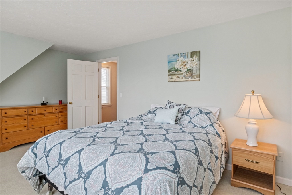 60 Tupper Avenue Sandwich, MA 02563 - Photo 17 of 35 a bedroom with a bed and a night stand