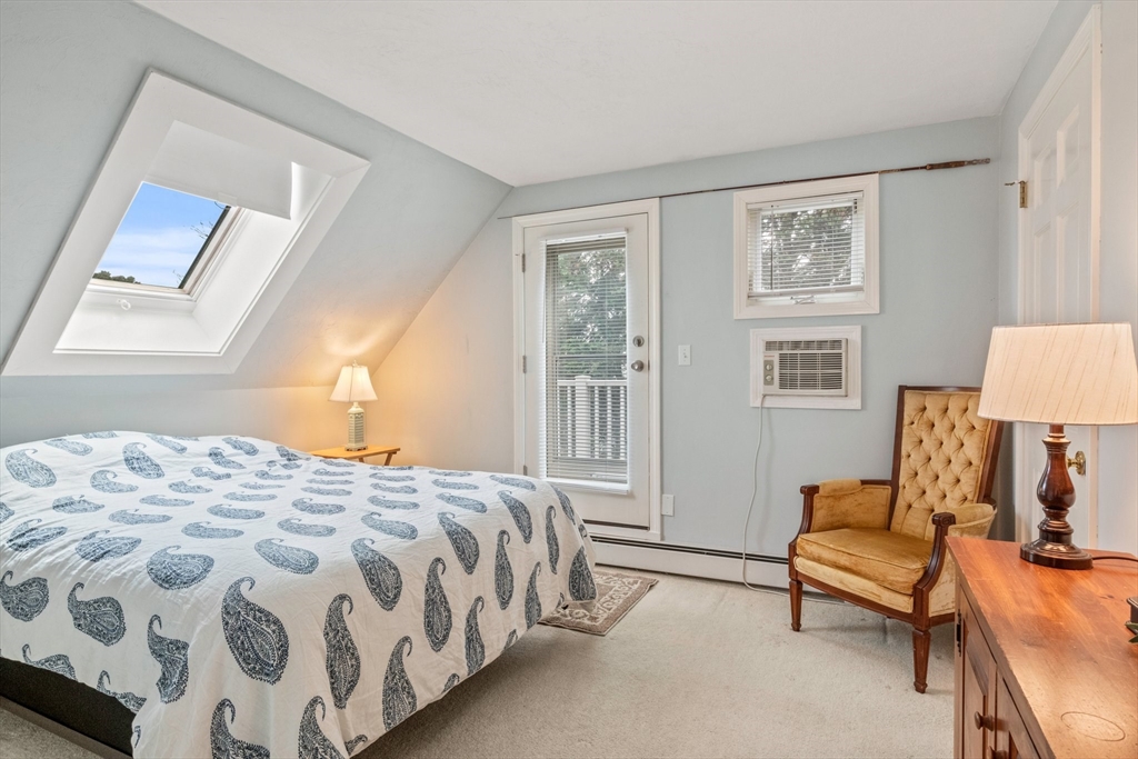 60 Tupper Avenue Sandwich, MA 02563 - Photo 19 of 35 a bedroom with a bed and wooden floor