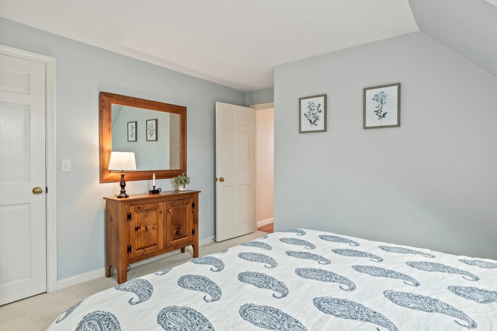 60 Tupper Avenue Sandwich, MA 02563 - Photo 20 of 35 a bedroom with a bed and a dresser in it