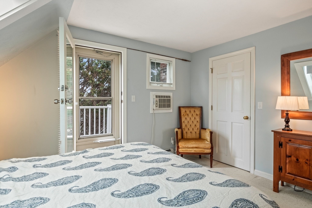 60 Tupper Avenue Sandwich, MA 02563 - Photo 21 of 35 a bedroom with a bed and wooden floor