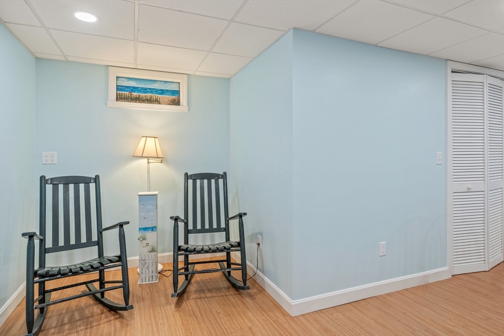 60 Tupper Avenue Sandwich, MA 02563 - Photo 23 of 35 a view of a room with wooden floor lounge chair and windows