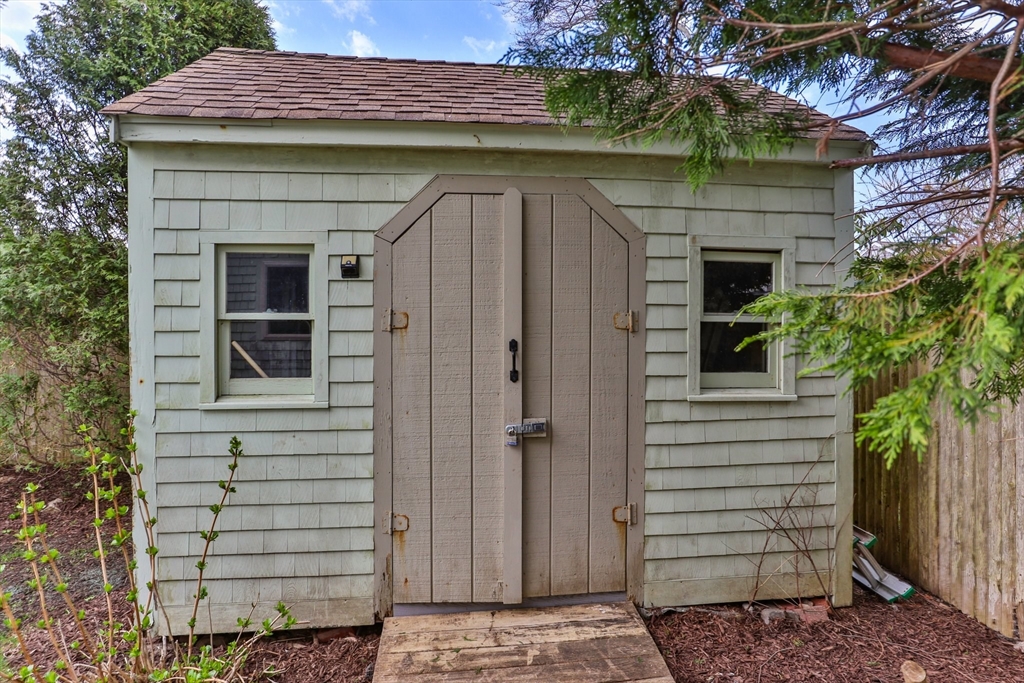 60 Tupper Avenue Sandwich, MA 02563 - Photo 28 of 35 a view of a wooden door and a tree in the house