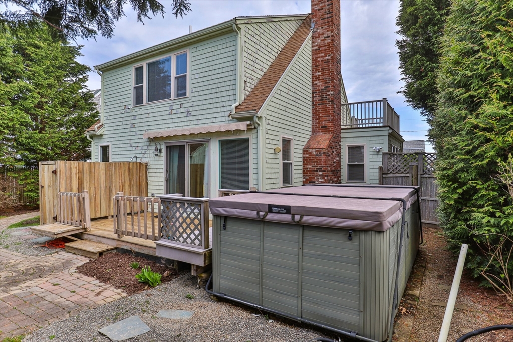 60 Tupper Avenue Sandwich, MA 02563 - Photo 29 of 35 a view of a house with a sink and wooden fence