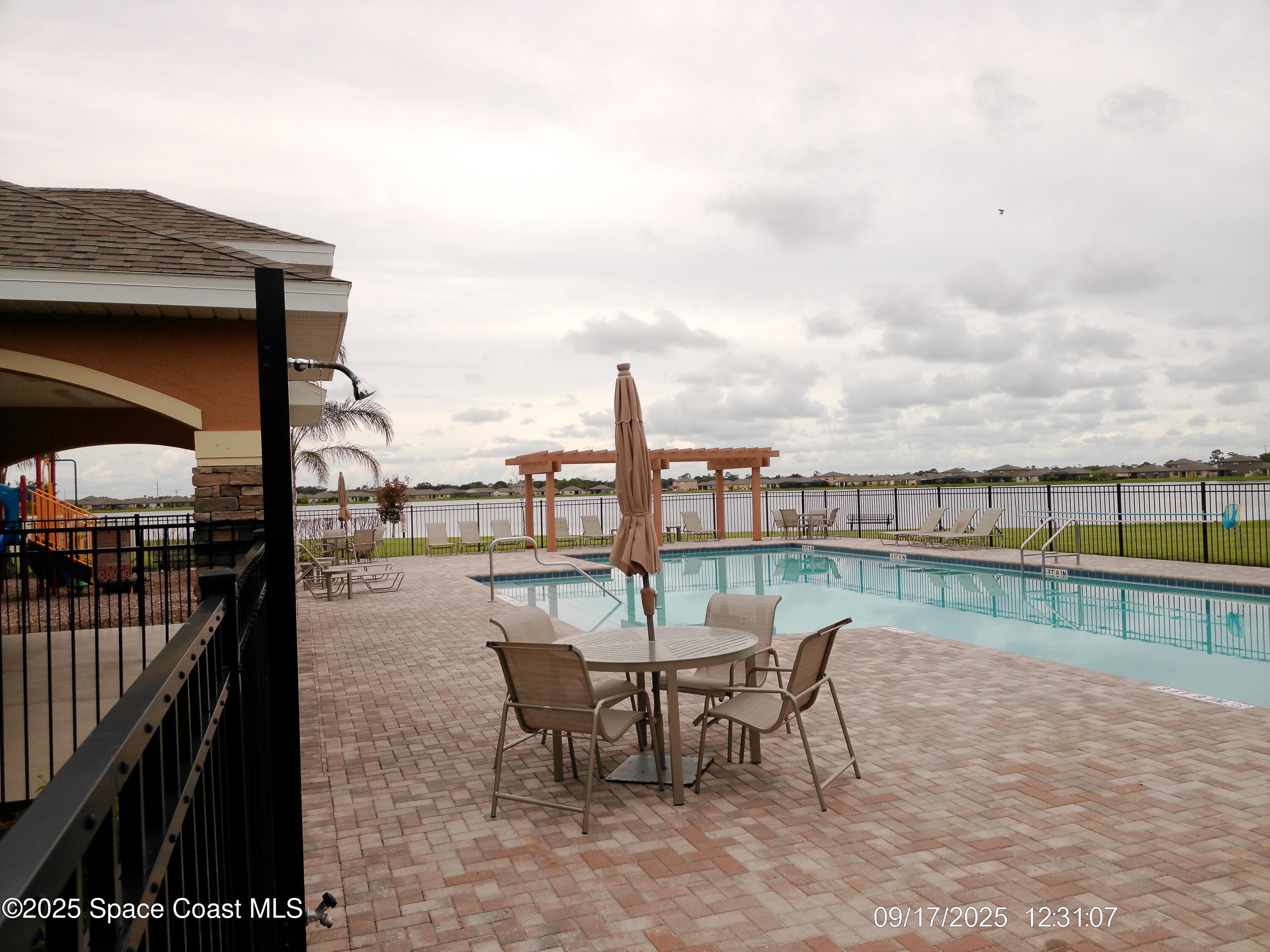 2073 Farmhouse Road Southeast Palm Bay, FL 32909 - Photo 14 of 14 a view of a terrace with sitting area