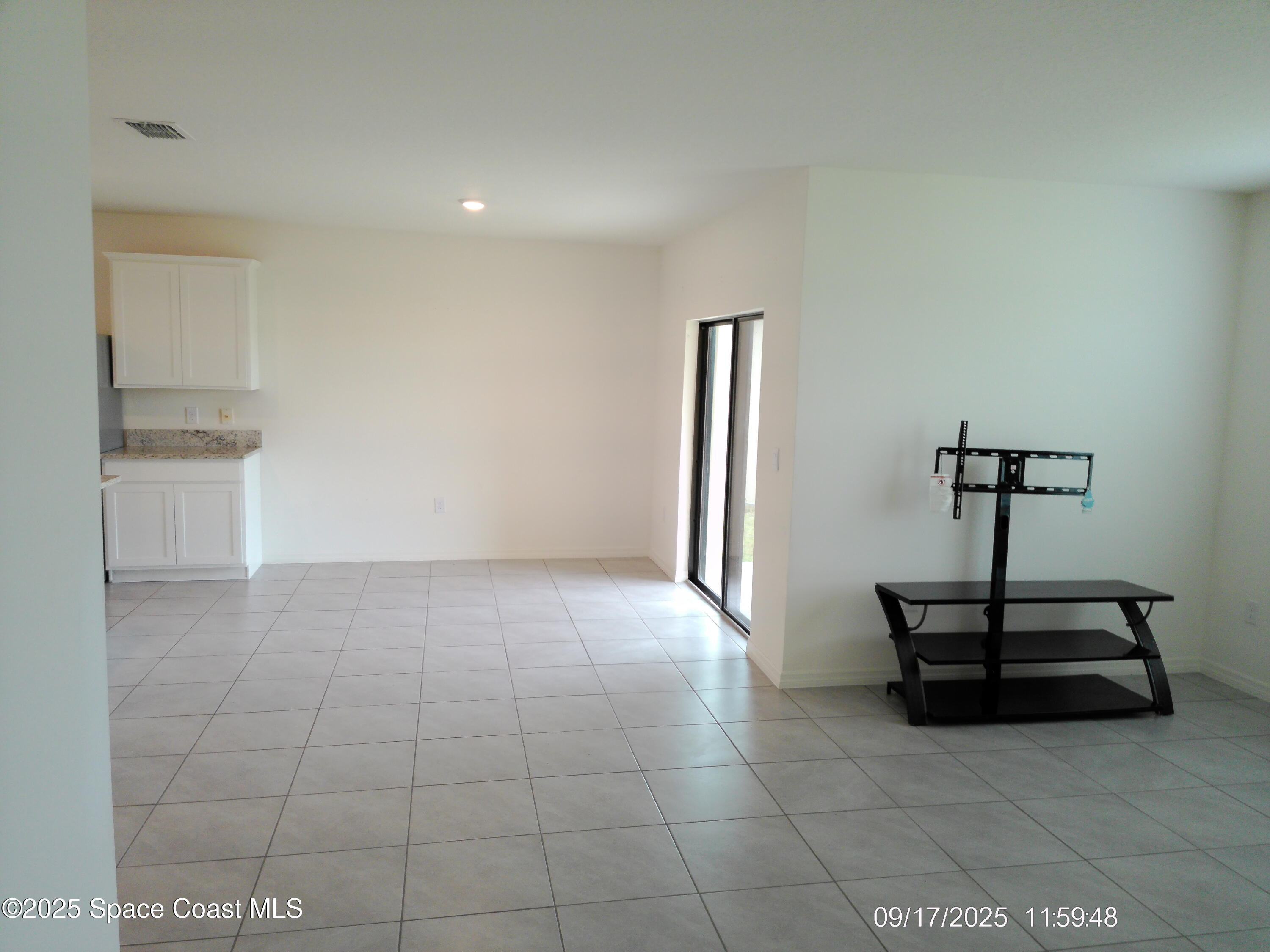 2073 Farmhouse Road Southeast Palm Bay, FL 32909 - Photo 8 of 14 a view of a room with a sink and a window
