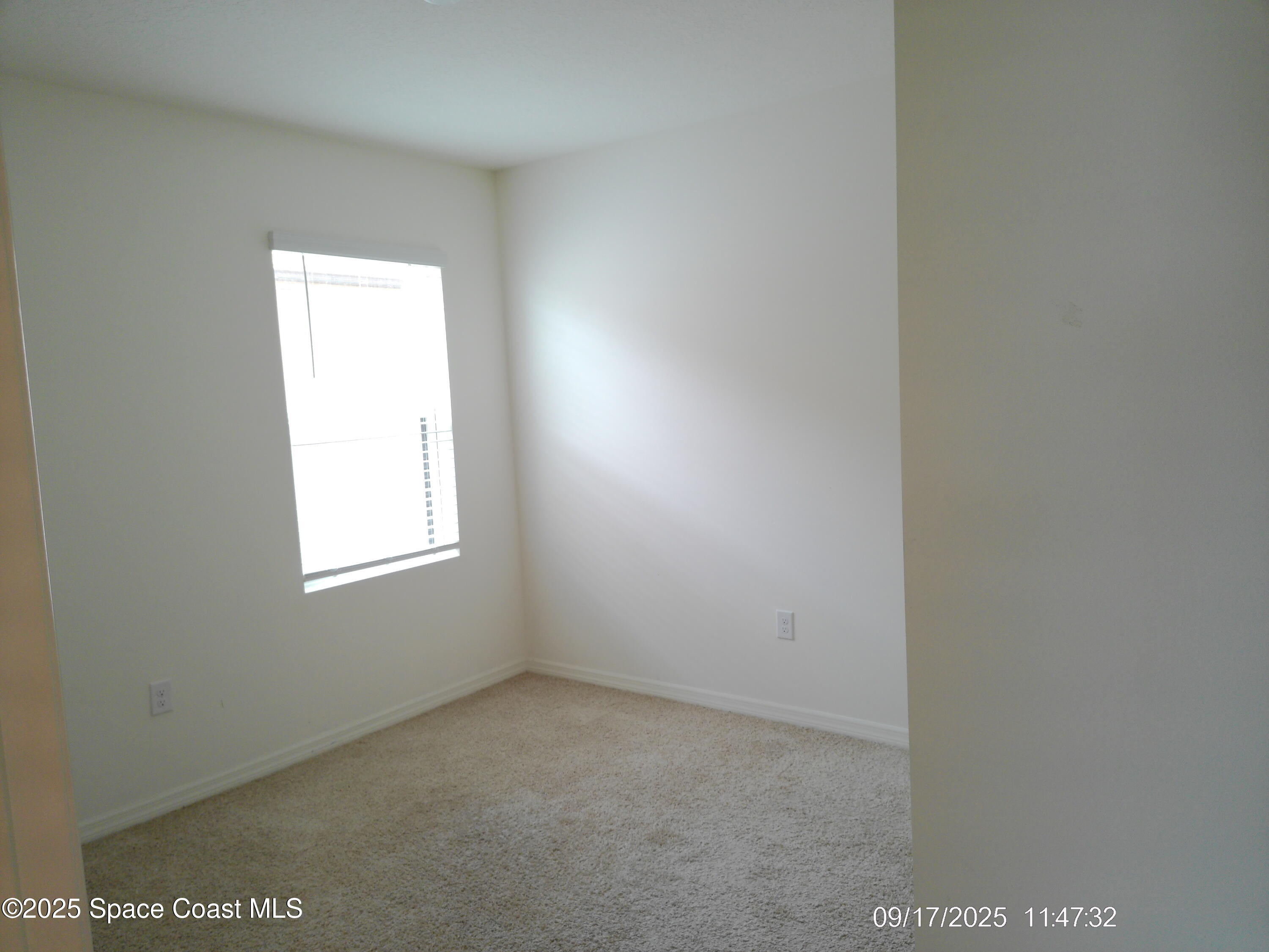2073 Farmhouse Road Southeast Palm Bay, FL 32909 - Photo 10 of 14 a view of an empty room with a window