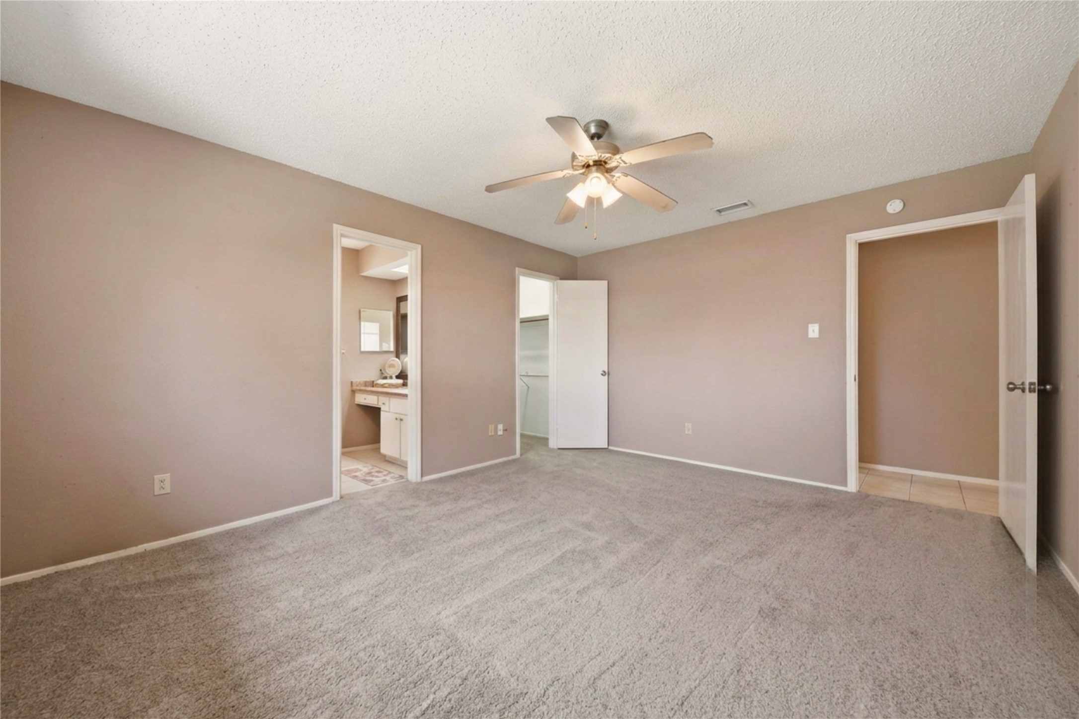 4019 Postwood Drive Spring, TX 77388 - Photo 24 of 50 a view of an empty room with a ceiling fan