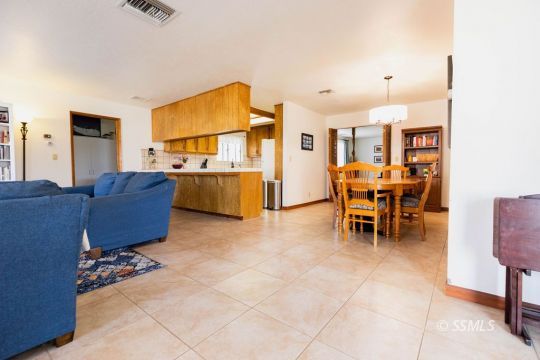 305 South Locust Street Ridgecrest, CA 93555 - Photo 15 of 36 a living room with furniture and a dining table