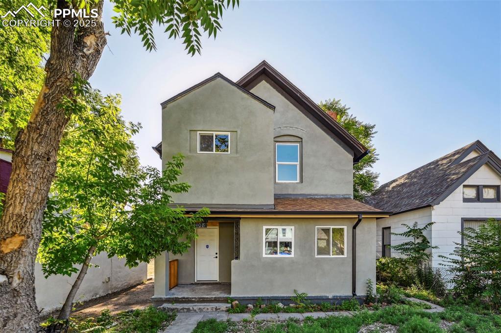 a front view of a house with a yard