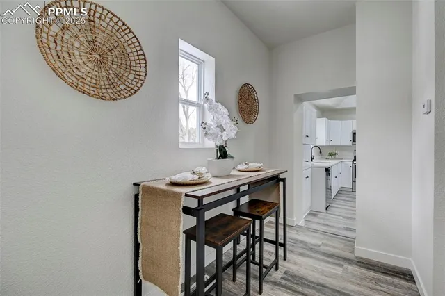 a view of a dining room with furniture and wooden floor