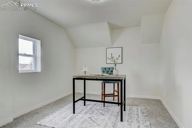 a view of a workspace with furniture