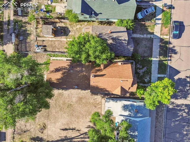 an aerial view of residential houses with outdoor space