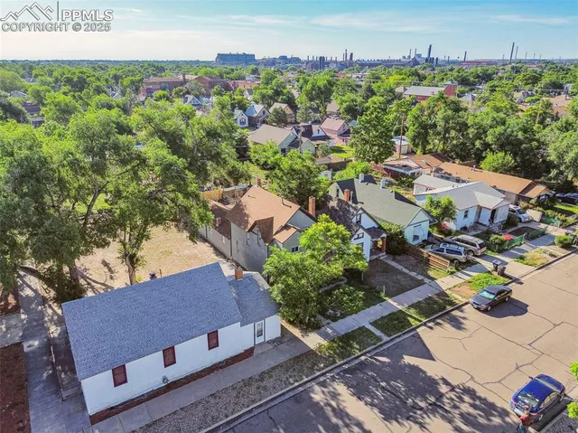 an aerial view of a house with a garden