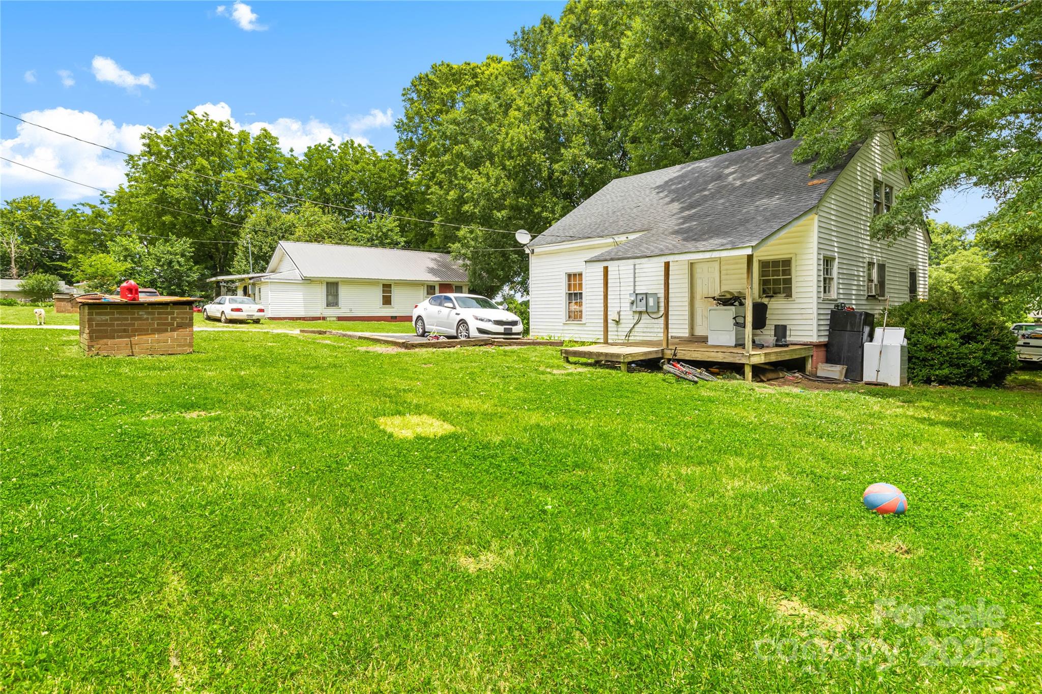 116 Webb Road Shelby, NC 28152 - Photo 5 of 15 a front view of a house with a garden and trees