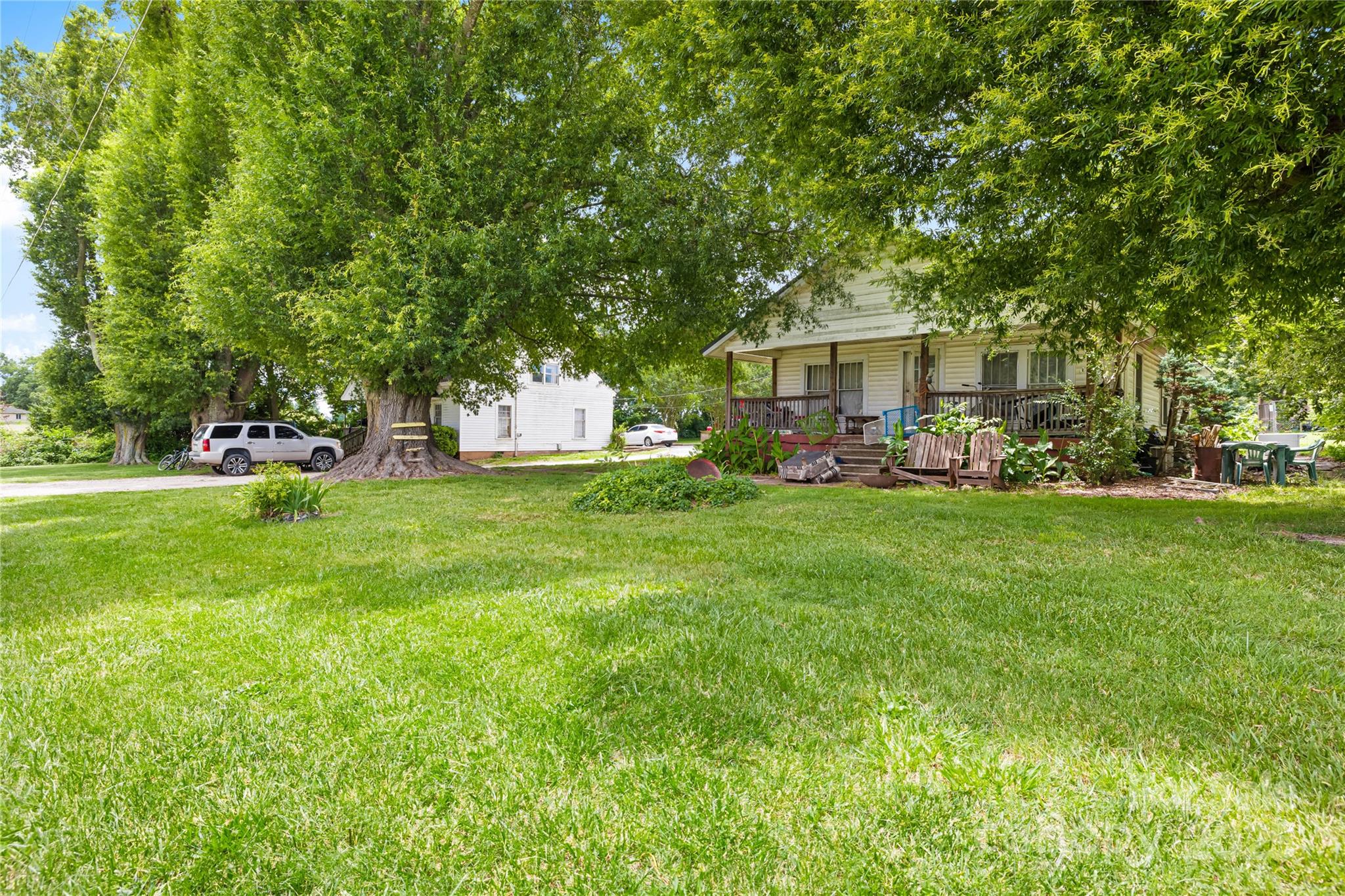 116 Webb Road Shelby, NC 28152 - Photo 7 of 15 a front view of a house with a garden and trees