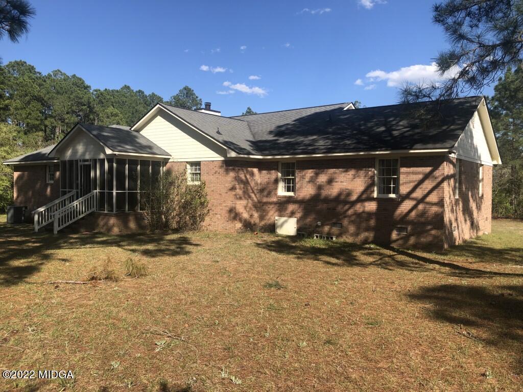 1589 Hamlin Road Lizella, GA 31052 - Photo 22 of 25 a view of a house with a snow in the yard